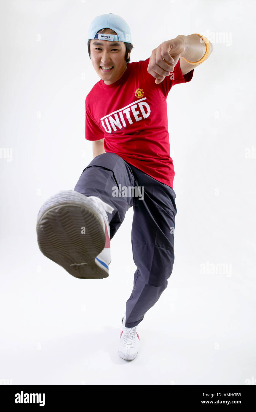 A man in football uniform is jumping Stock Photo