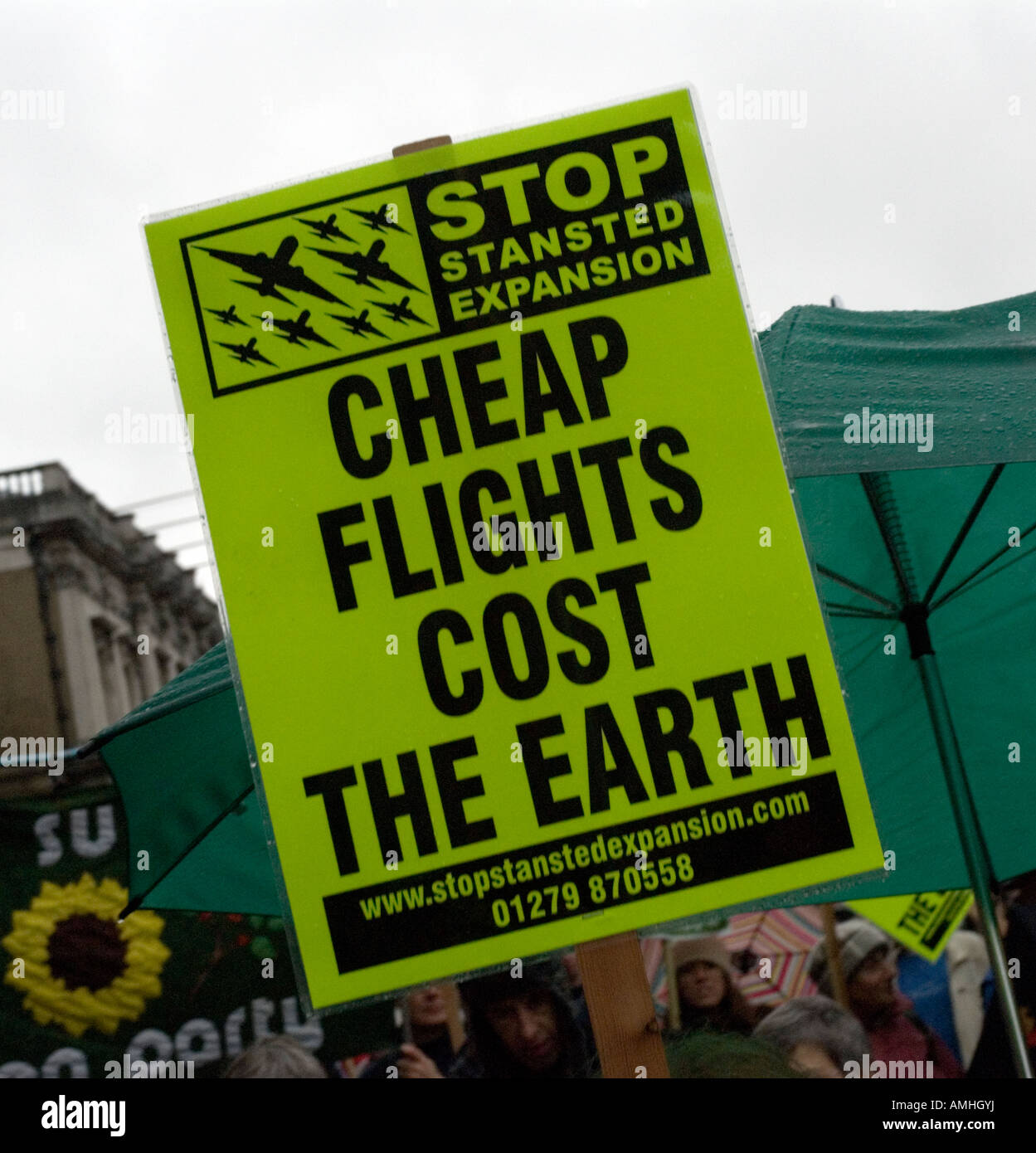 "Cheap Flights cost the Earth" protestors placard Climate Change march