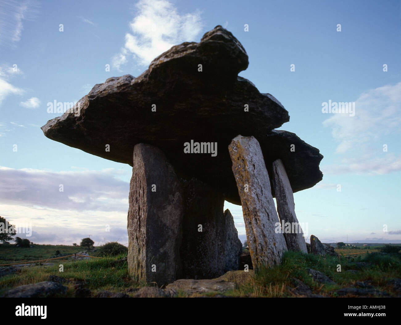 large archaeological stone built burial chamber from former times on the irish landscape Stock Photo