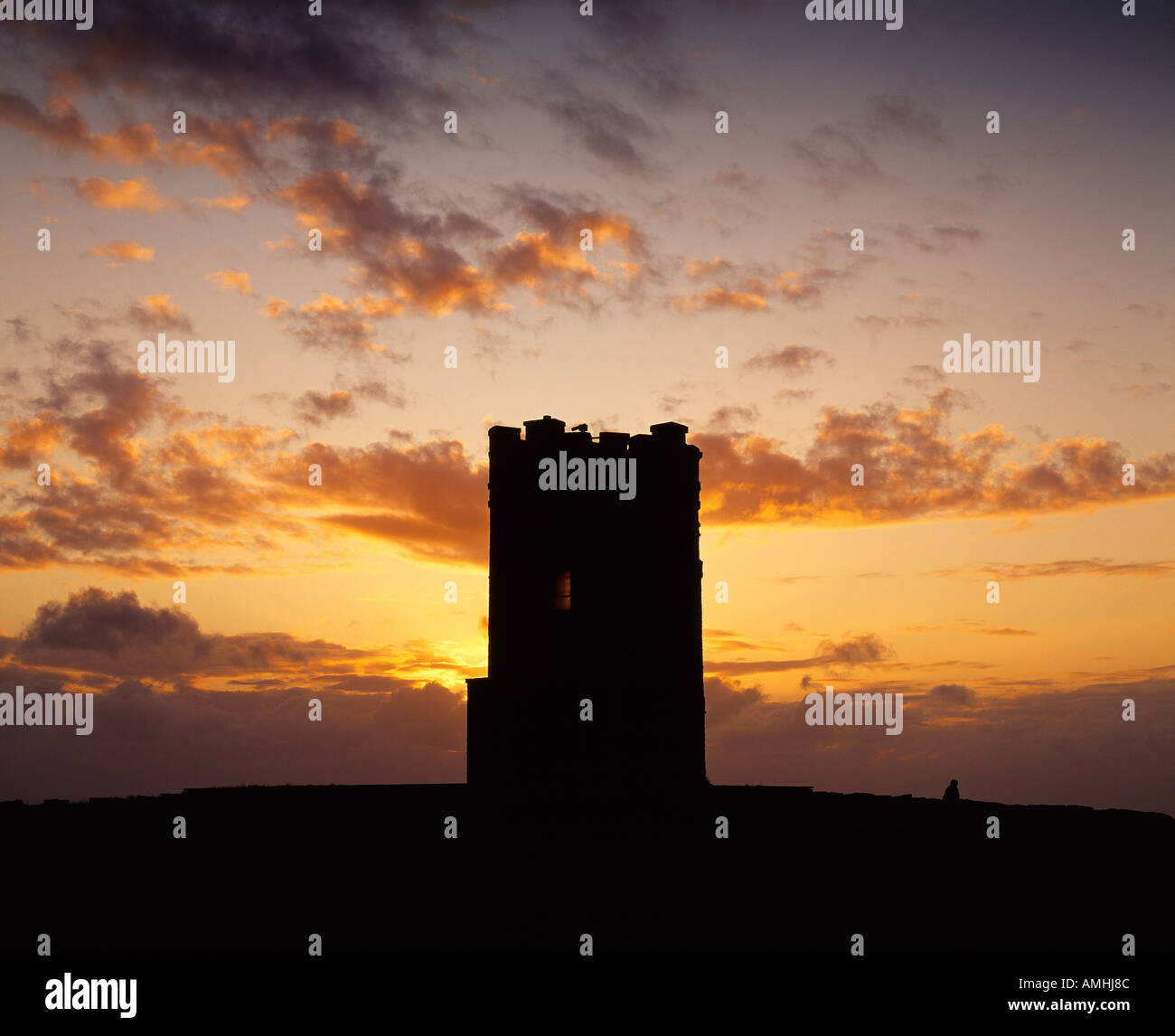 watch tower on irelands  irish atlantic coast with the evening sky, beauty in nature, Stock Photo