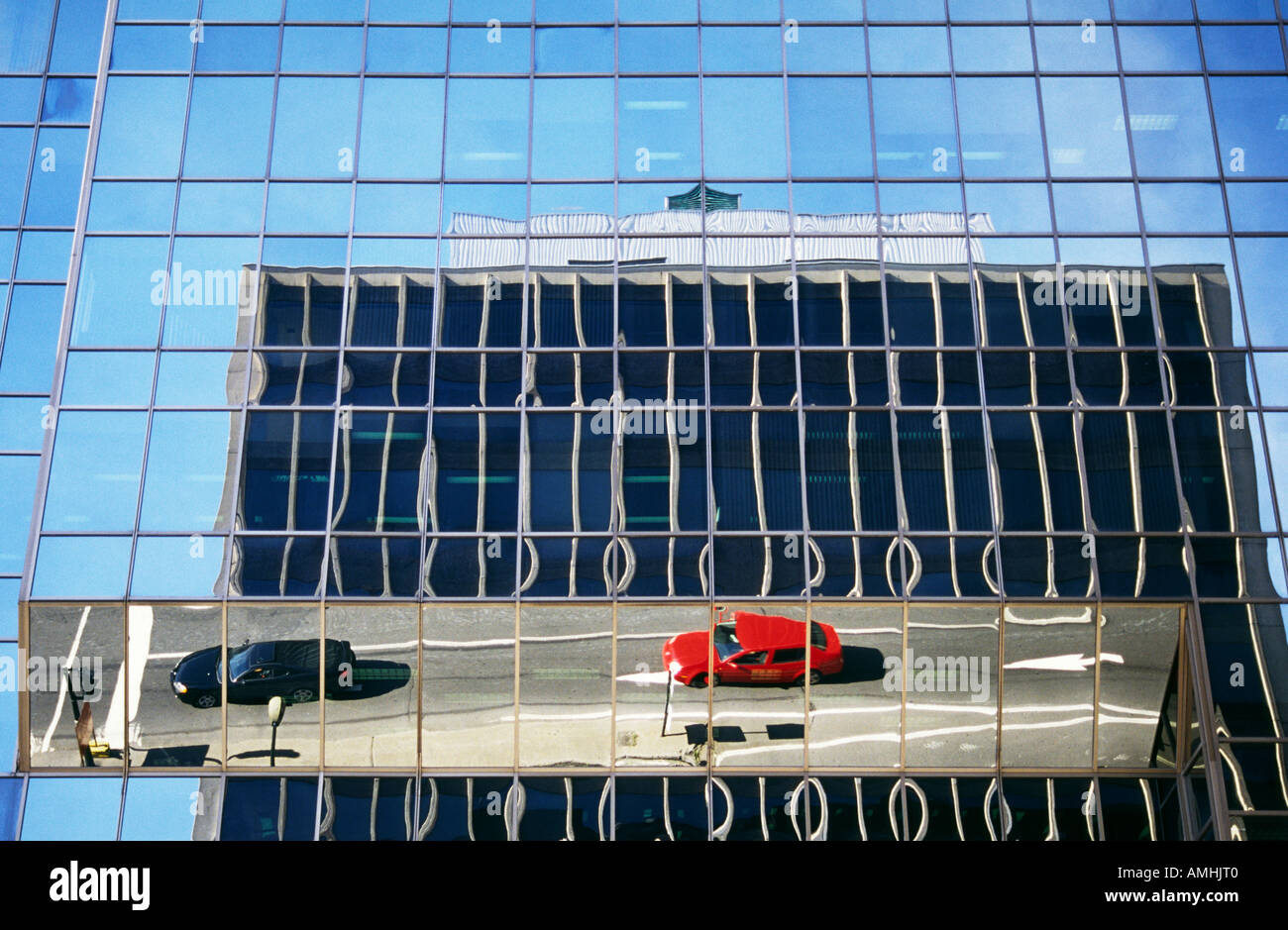 Street scene reflected in building window Montreal Quebec Canada Stock Photo