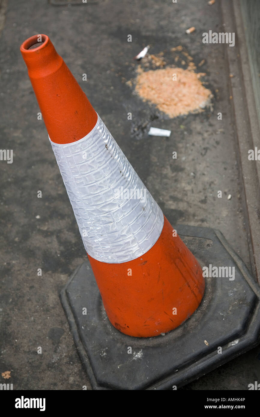 Traffic cone and vomit Stock Photo
