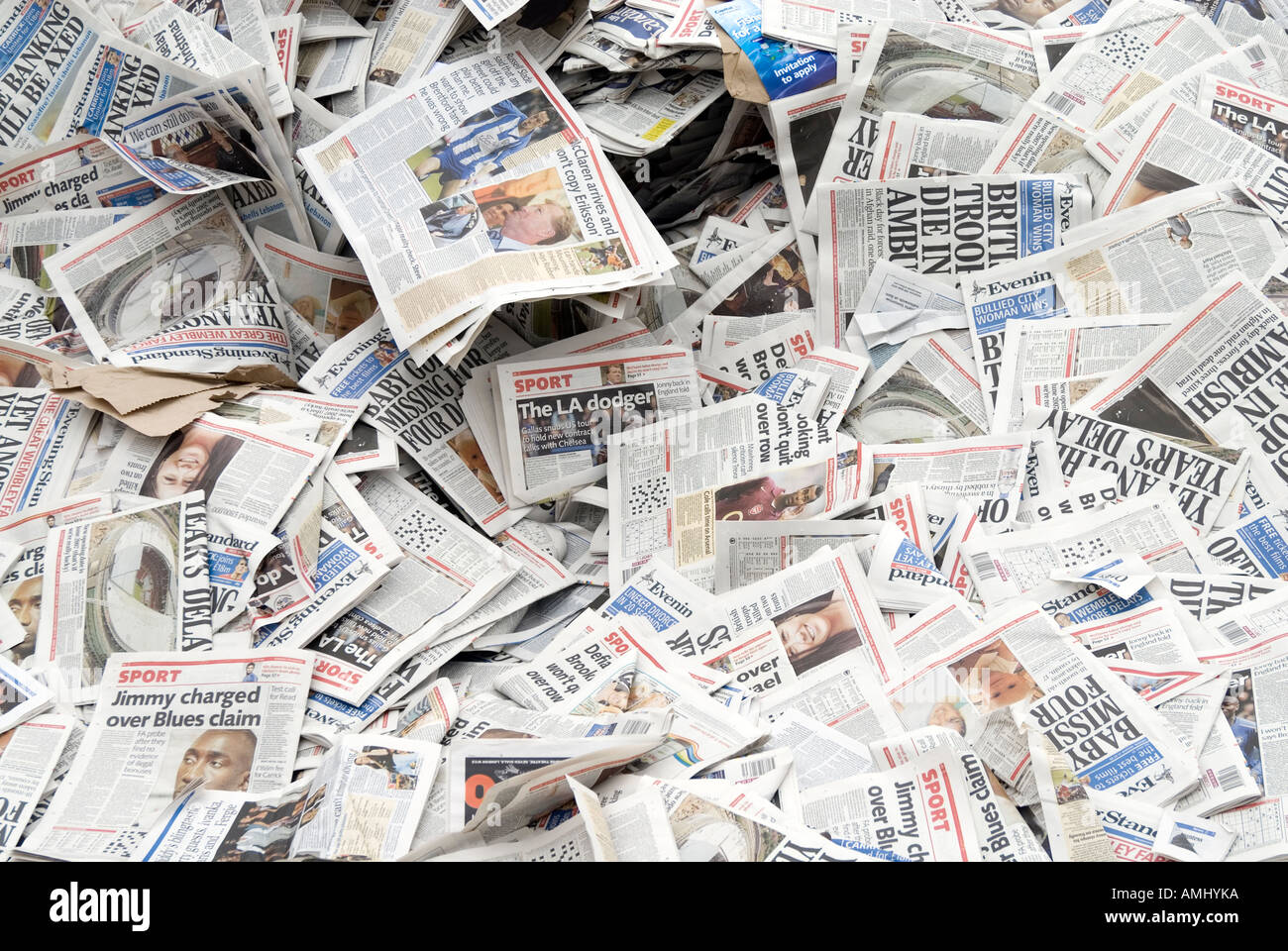 Pile of returned newspapers at paper recycling facility, England UK