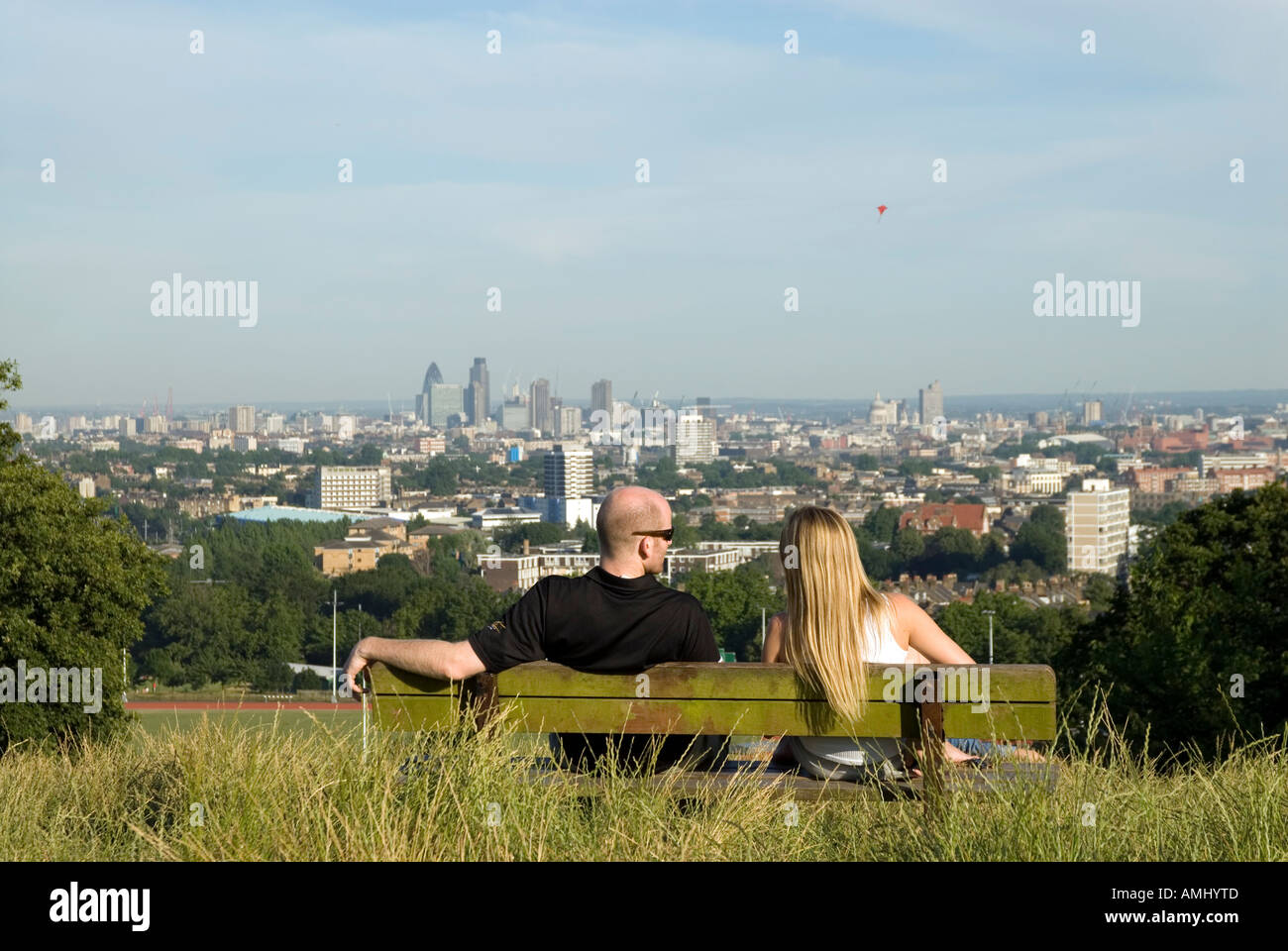Couple enjoying the view from high up on Parliament Hill on Hampstead Heath London England UK Stock Photo