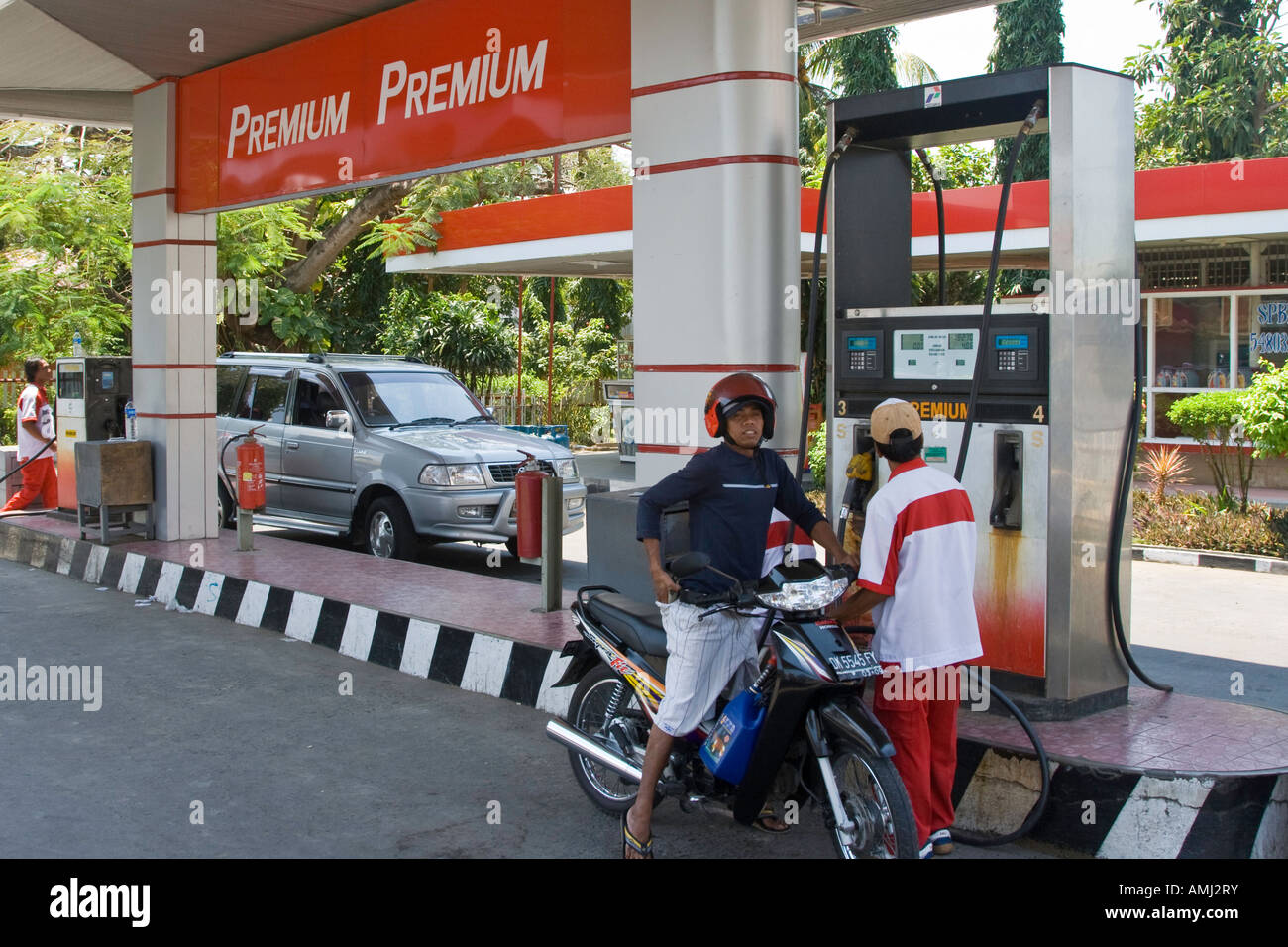 Motobrike Filling up with Petrol at a Preimum Gas Station Bali Indonesia Stock Photo