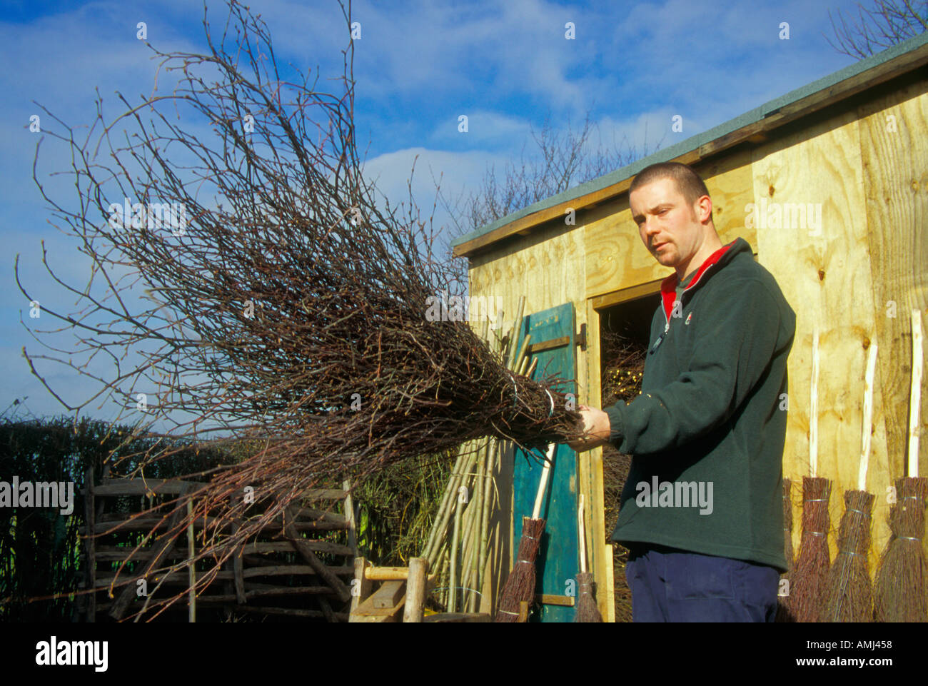 Adam King making the traditional besom brooms in the same way as his family have done for many years at High Wycombe. Stock Photo