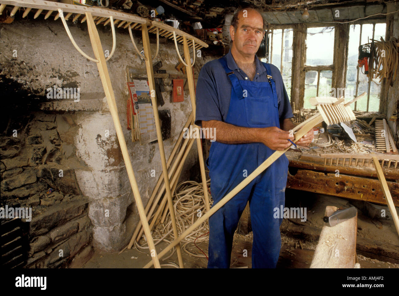 John Rudd making the traditional hay rake in his workshop near