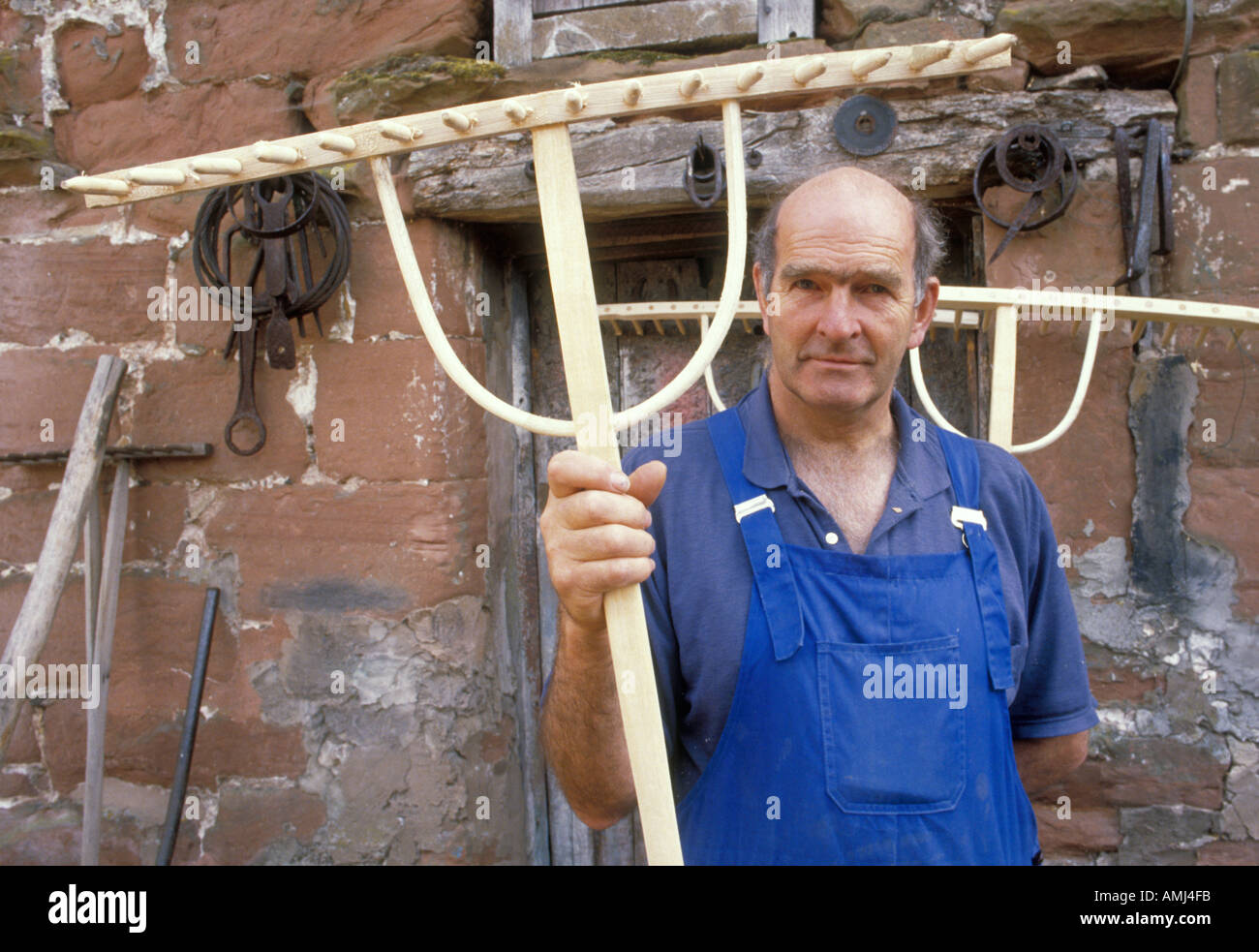 John Rudd making the traditional hay rake in his workshop near