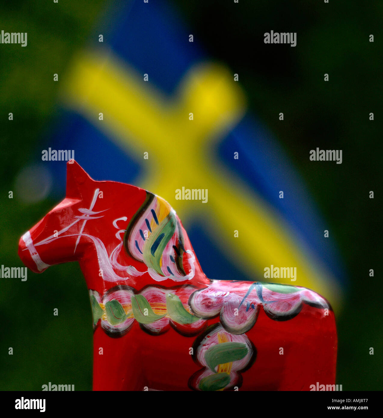 A Dala horse and a swedish flag Stock Photo Alamy