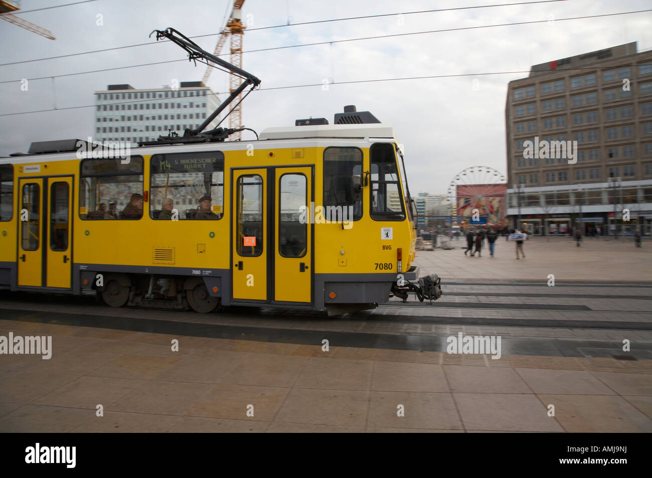 BVG berlin yellow tram travelling though alexanderplatz Berlin Germany Stock Photo