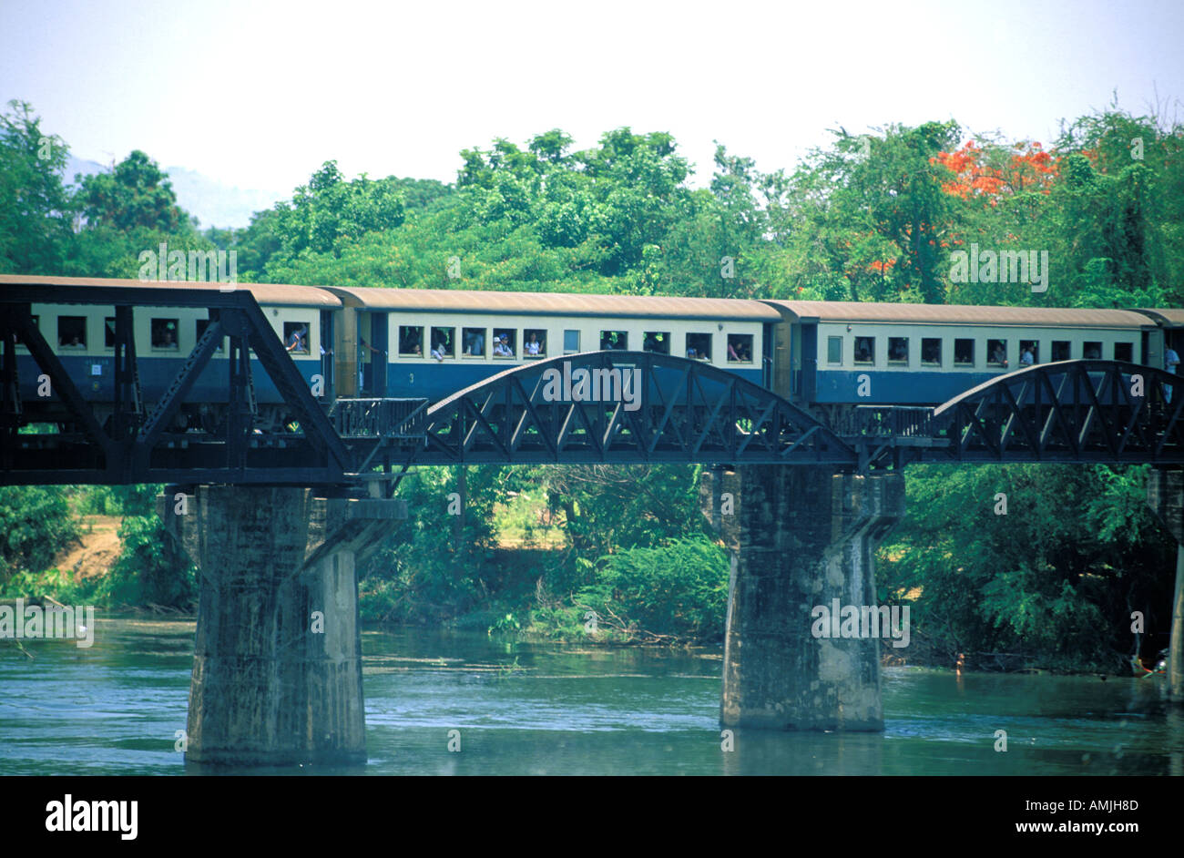 Train crossing over a river bridge hires stock photography and images