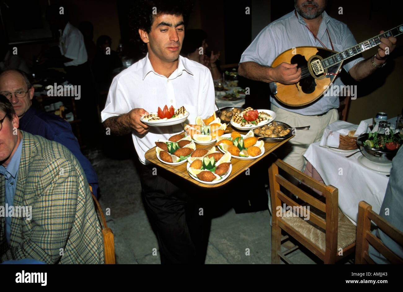 Nicosia a waiter serving typical desserts Stock Photo