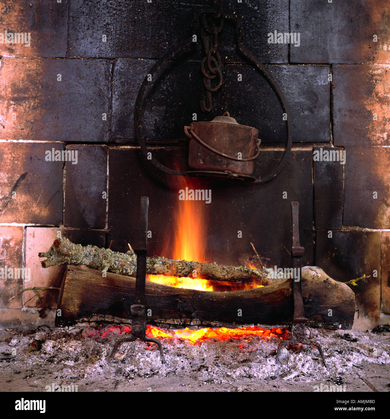 old fireplace fireside with fire and pot Stock Photo Alamy
