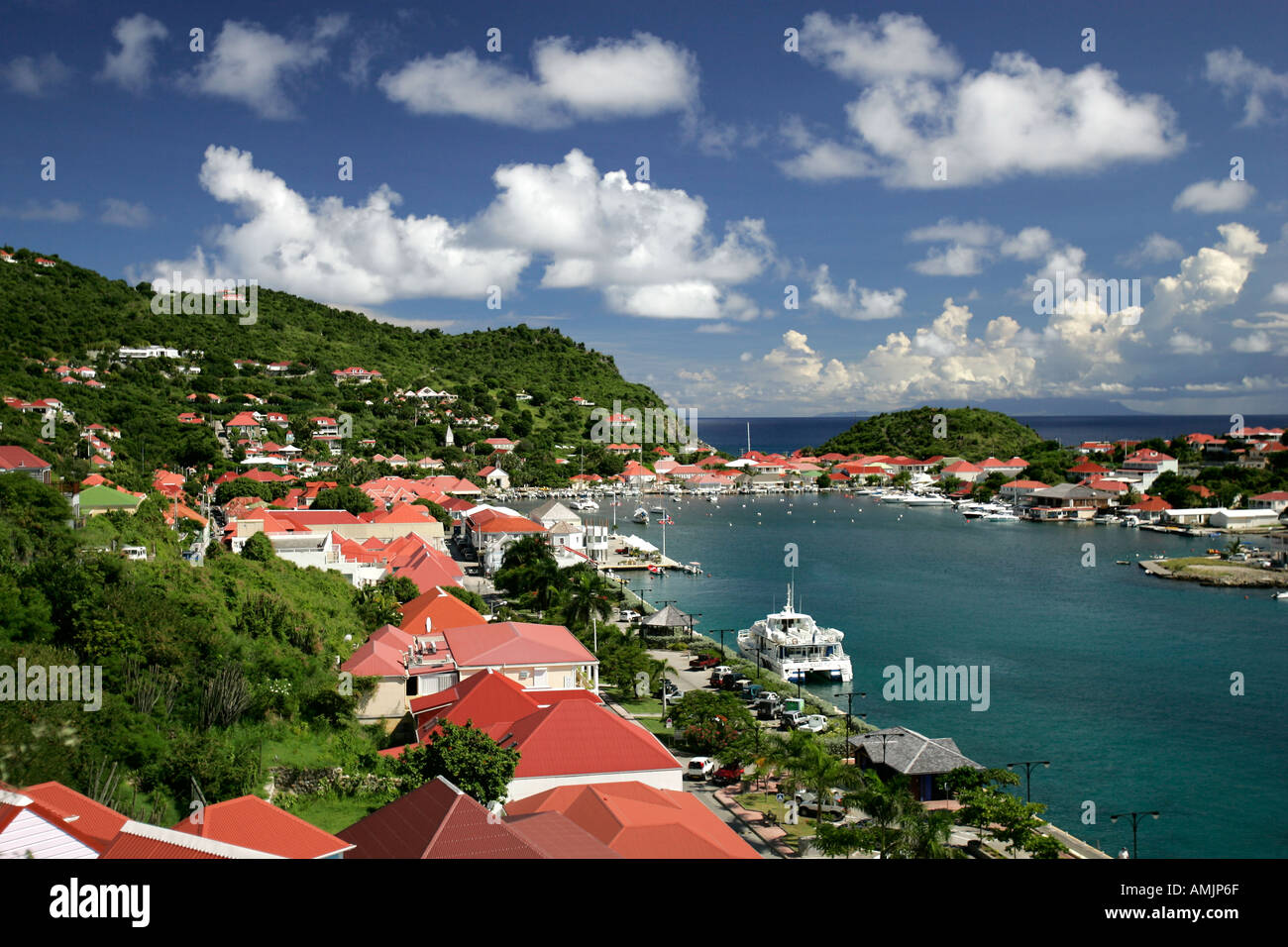 Red tin roof buildings surround attractive Gustavia Harbour St Barts Stock Photo