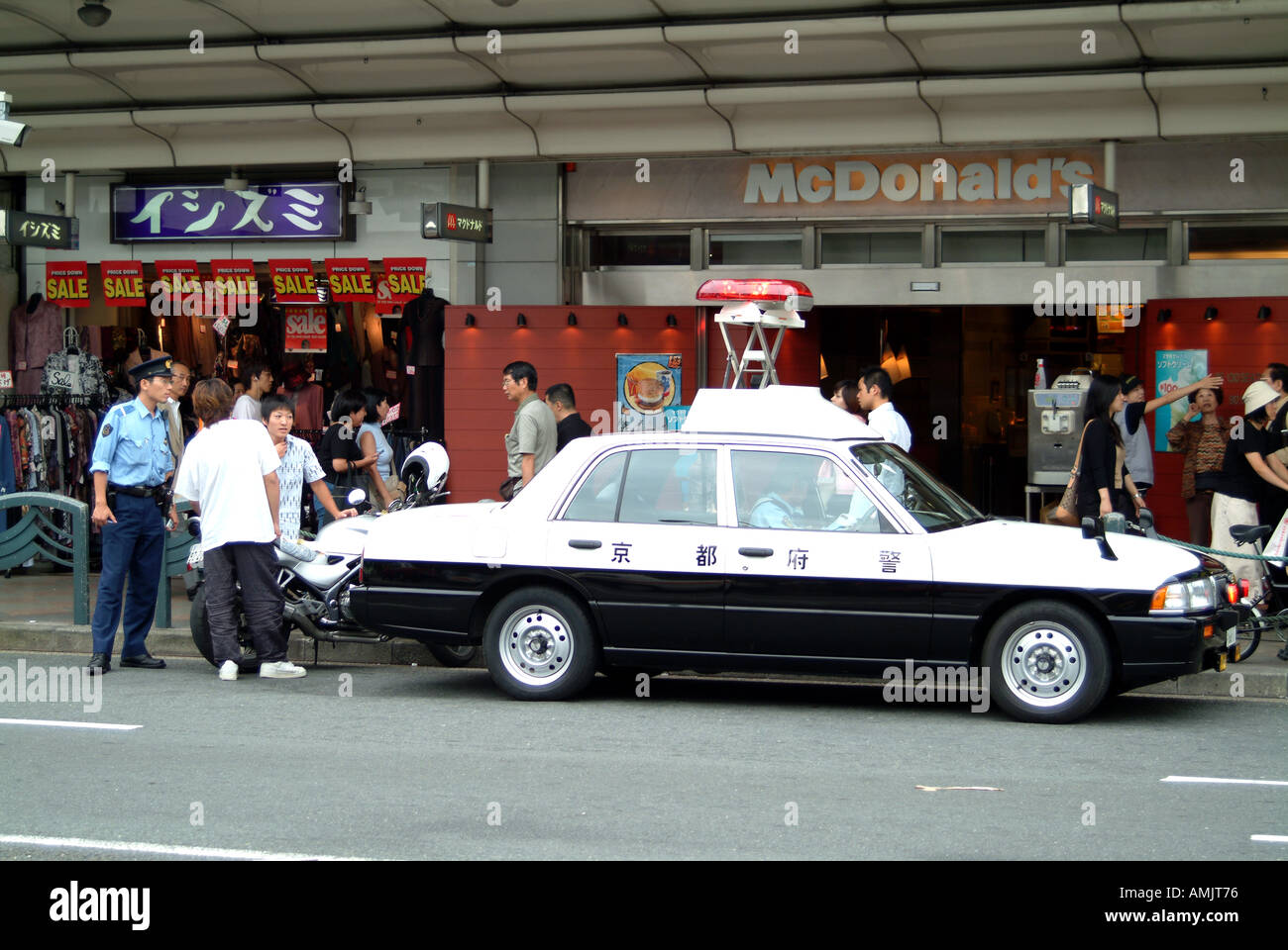 Police talking to motorcyclist Kyoto Japan Stock Photo