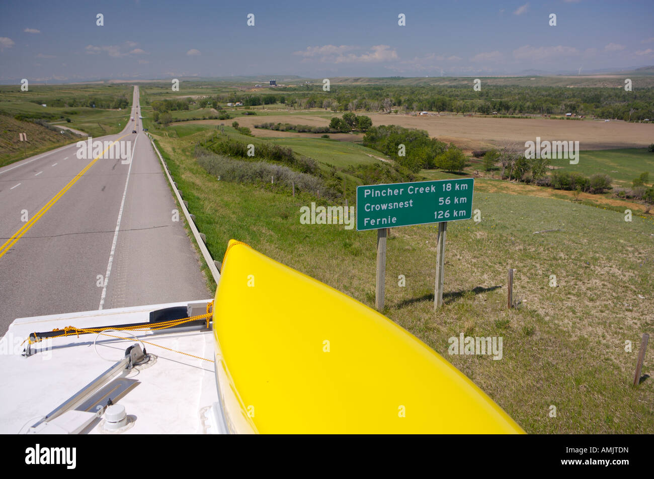 Highway 3 road and the southern Alberta Prairies from the roof of a camper, Southern Alberta, Alberta, Canada. Stock Photo