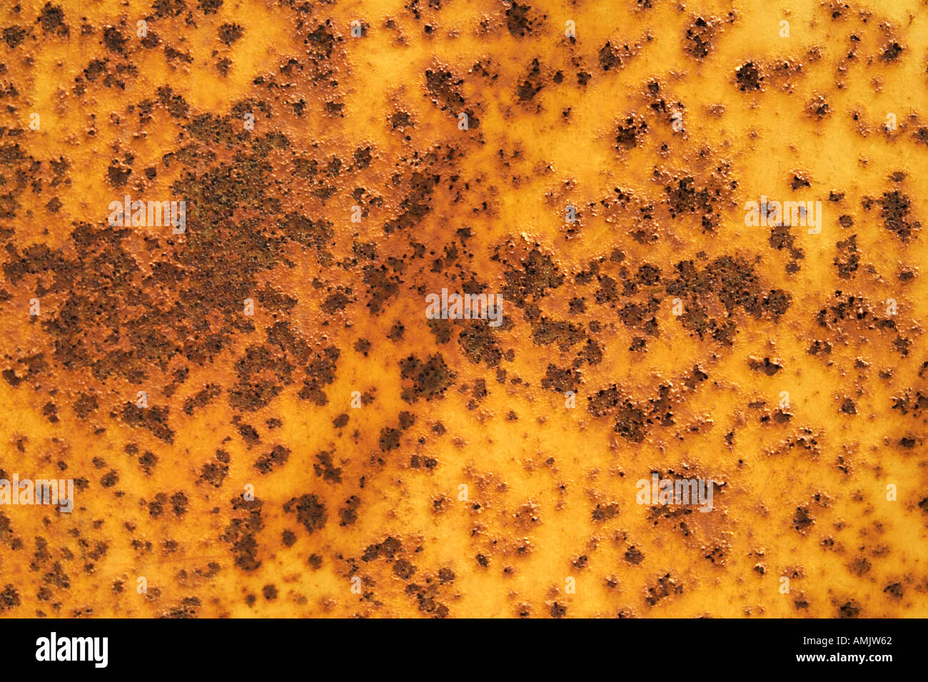 Horizontal close up of rusting yellow metal Stock Photo