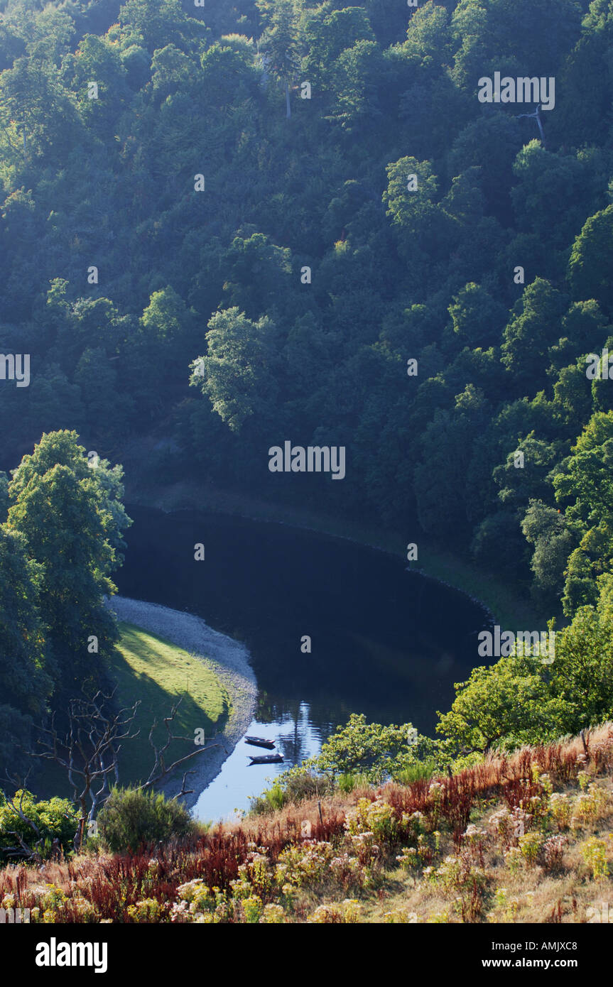 Fishing boats on bank of the River Tweed in the Eildon Hills seen from ...
