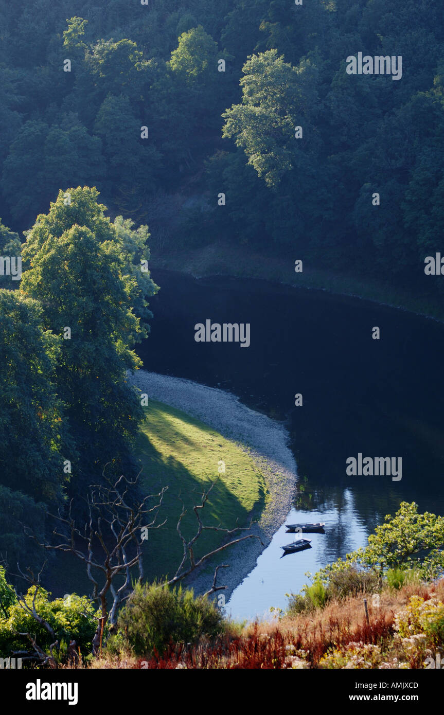 Fishing boats on bank of the River Tweed in the Eildon Hills seen from ...