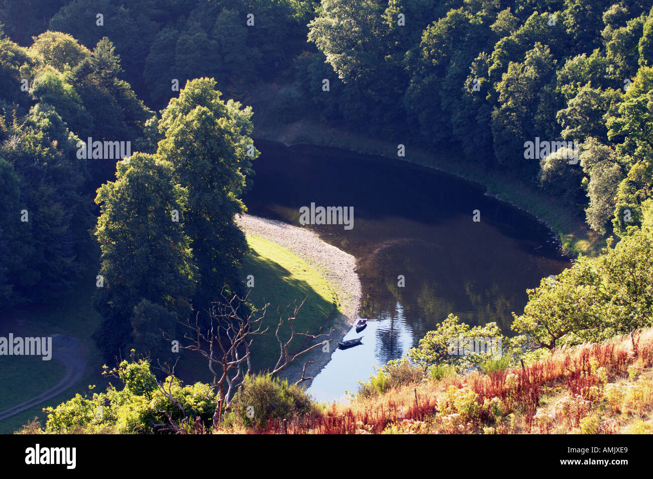 Fishing boats on bank of the River Tweed in the Eildon Hills seen from ...