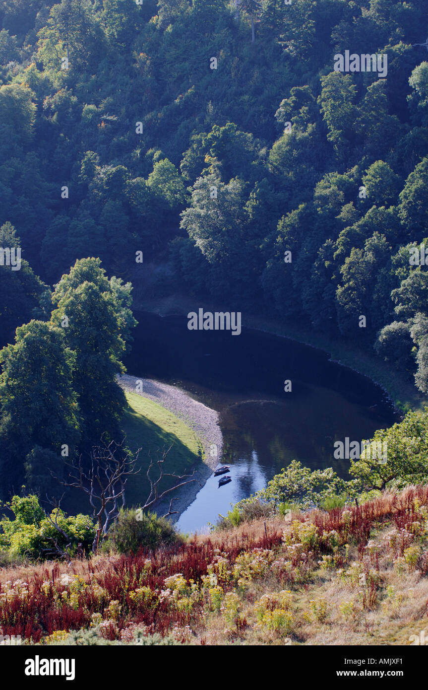 Fishing boats on bank of the River Tweed in the Eildon Hills seen from ...