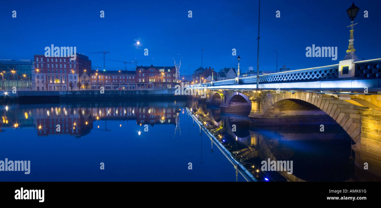 Panoramic landscape at night of Queens Bridge and River Lagan Waterfront Belfast Northern Ireland Stock Photo