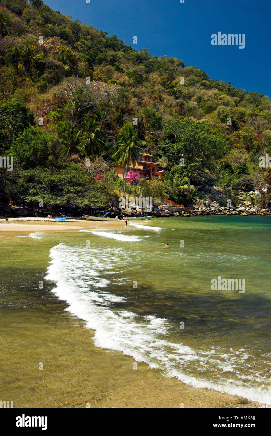 A small sandy beach cove with colorful boats on Banderas Bay south of Puerto Vallarta Mexico Stock Photo