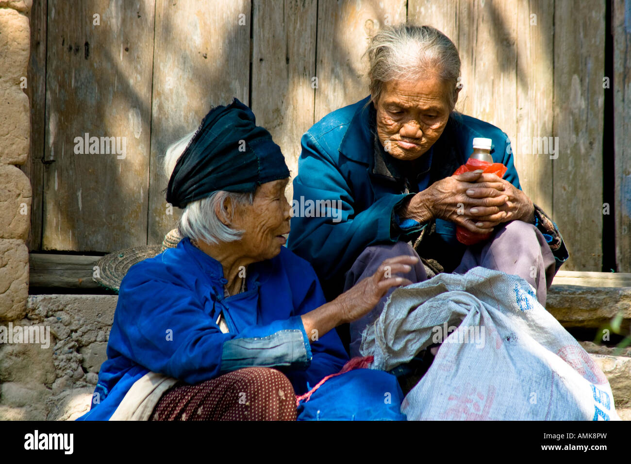 Two Old Chinese Women in the Rural Countryside town of Bai Sha near Yangshuo China Stock Photo