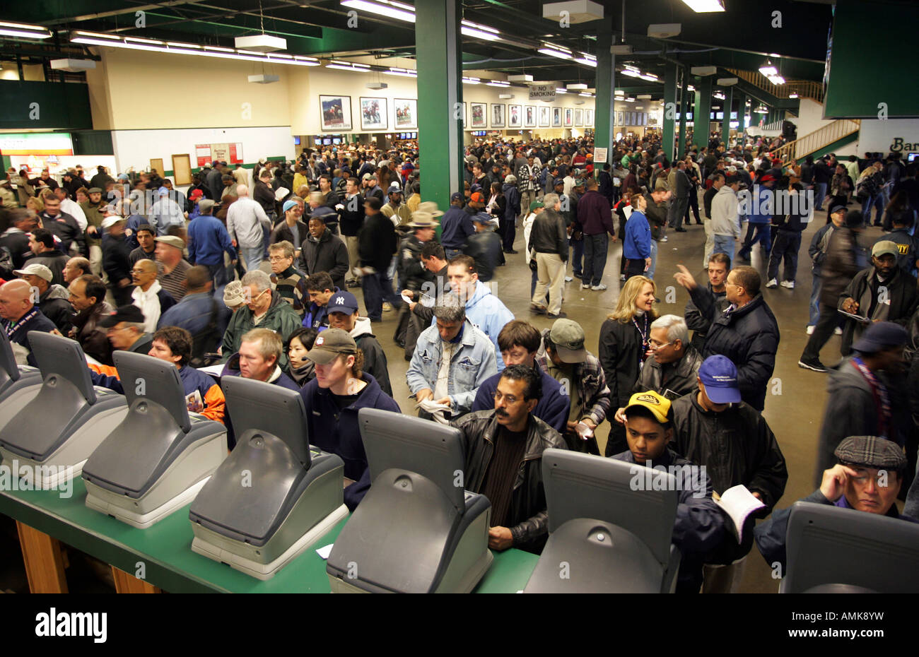 People at the betting hall at the Belmont Park race course, New York, USA Stock Photo