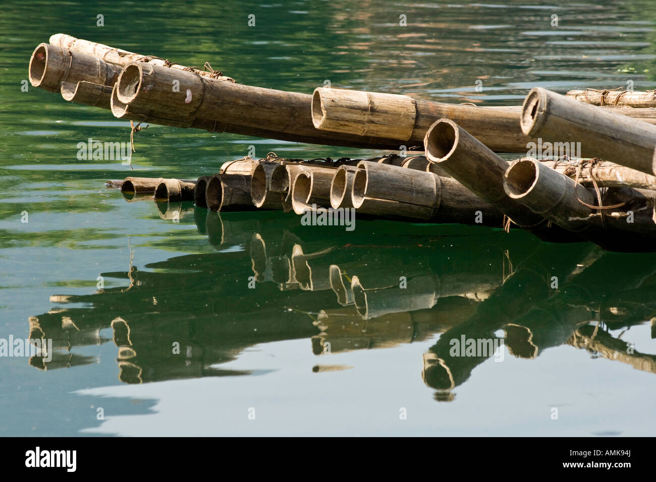 Closeup Detail of a Bamboo Raft and Reflection in the Li River Yangshuo China Guangxi Province Stock Photo