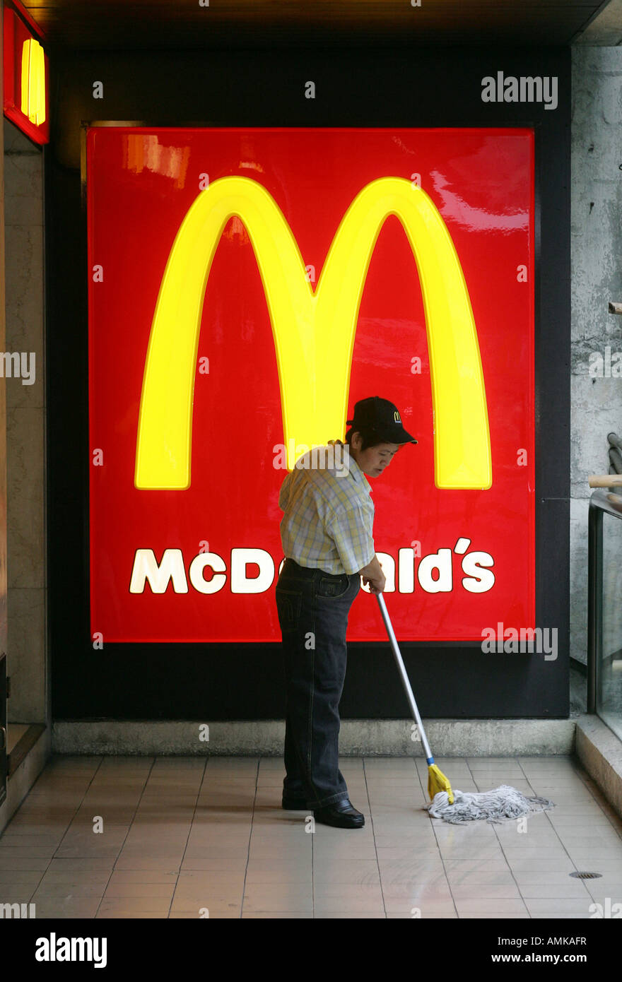Cleaner at a McDonalds restaurant in Hong Kong Stock Photo
