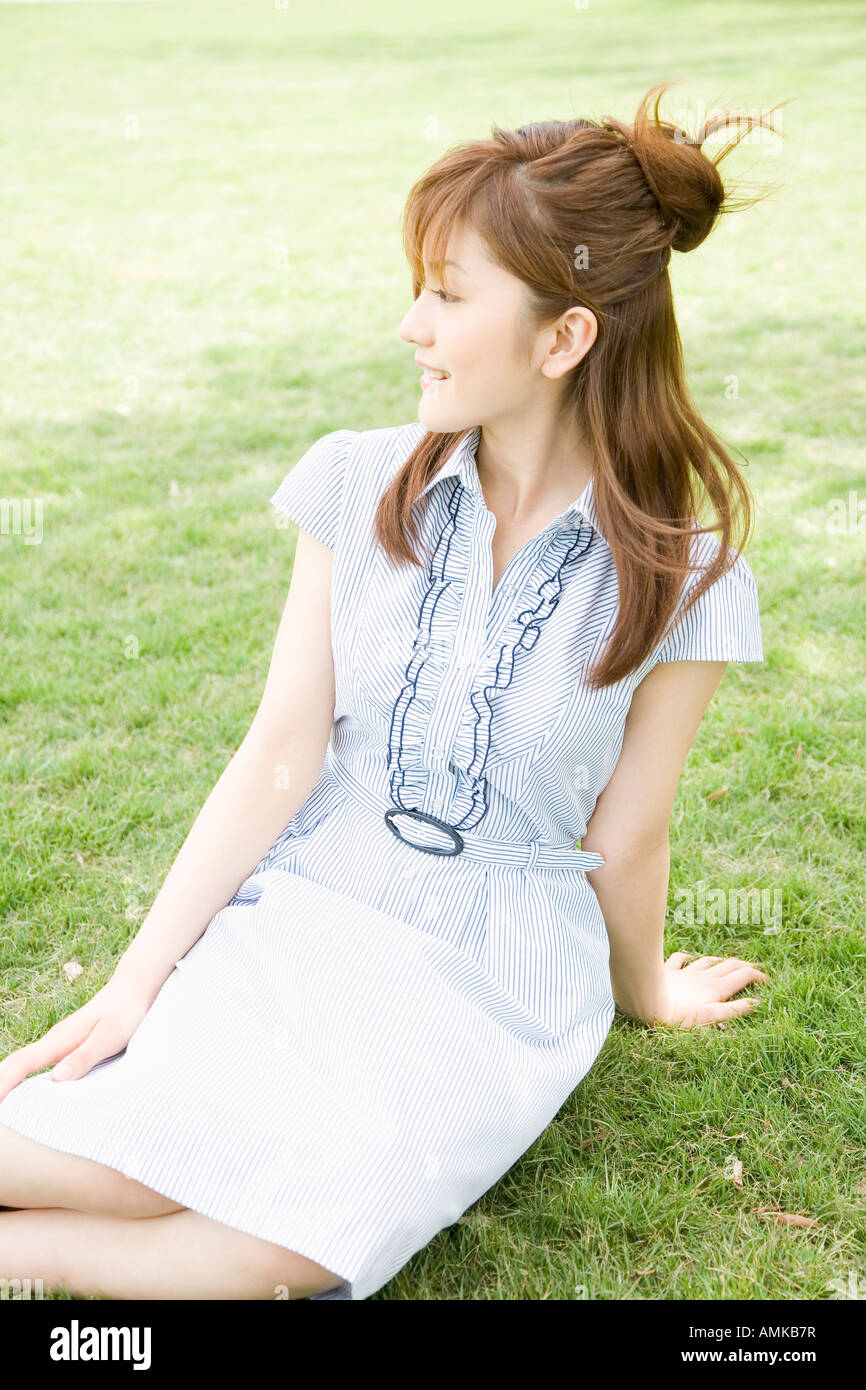 Person sitting in park hi-res stock photography and images - Alamy