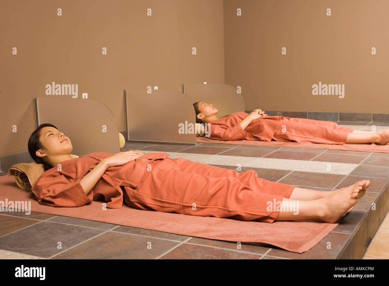 Young women lying at bedrock bath Stock Photo - Alamy