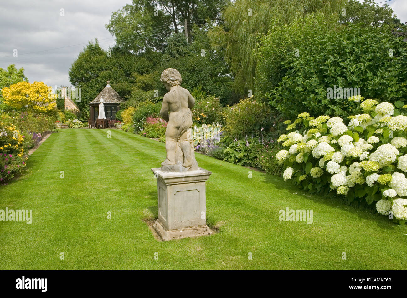 Lawn with statue Stock Photo Alamy