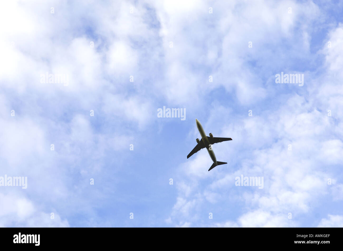 aircraft airplane jet aeroplane passenger airliner airline flying in sky seen from below Stock Photo