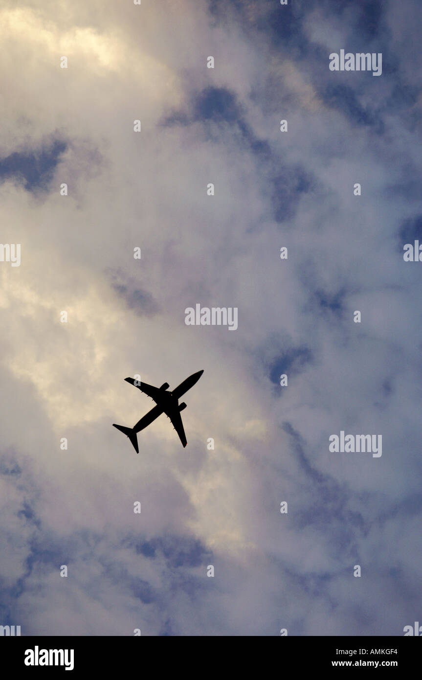 aircraft airplane jet aeroplane passenger airliner airline flying in sky seen from below Stock Photo