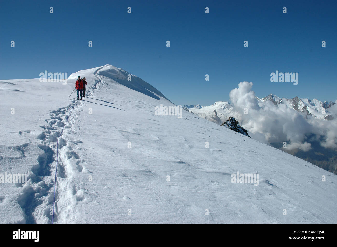 Climbers summit ridge ascending the Fletschhorn 3996 m Valais Switzerland Stock Photo