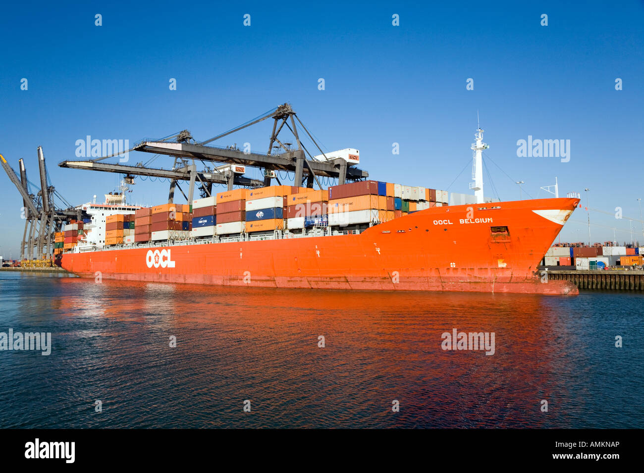 Container Ship OOCL Belgium being loaded at Southampton Container Port Stock Photo