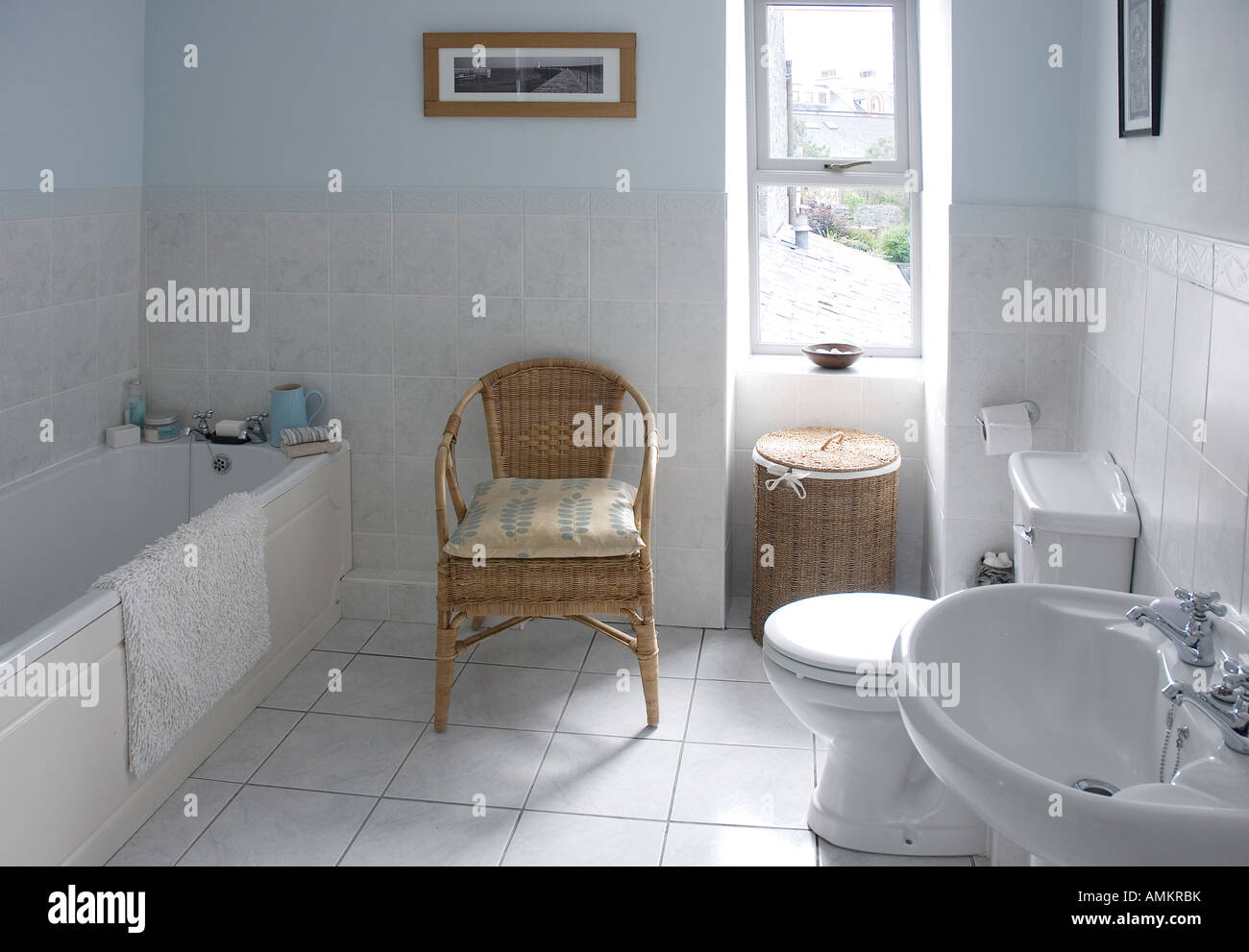 Bathroom interior with chair and tiled floor Stock Photo