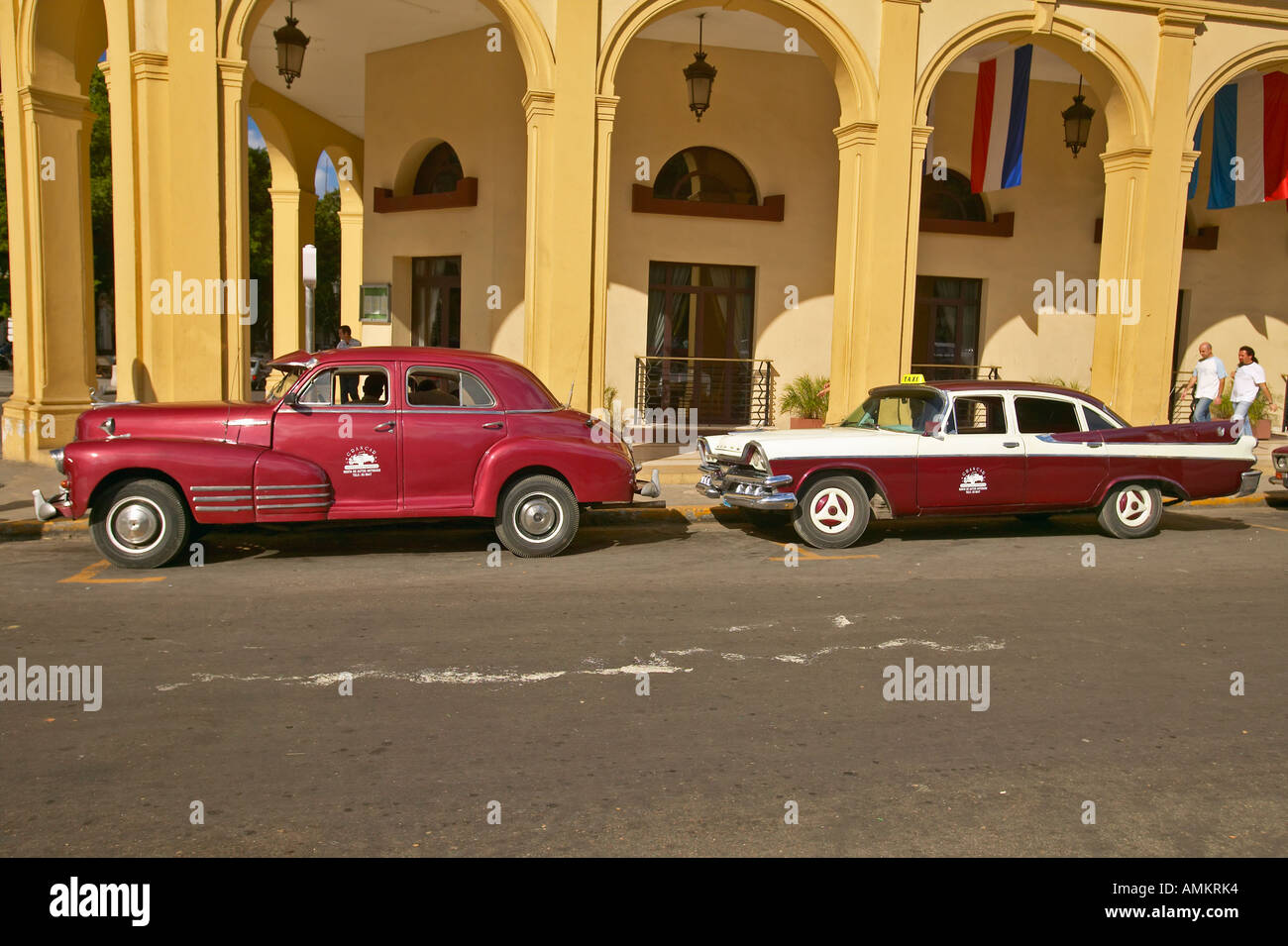 Classic old American cars parked in front of hotel in Old Havana Cuba Stock Photo