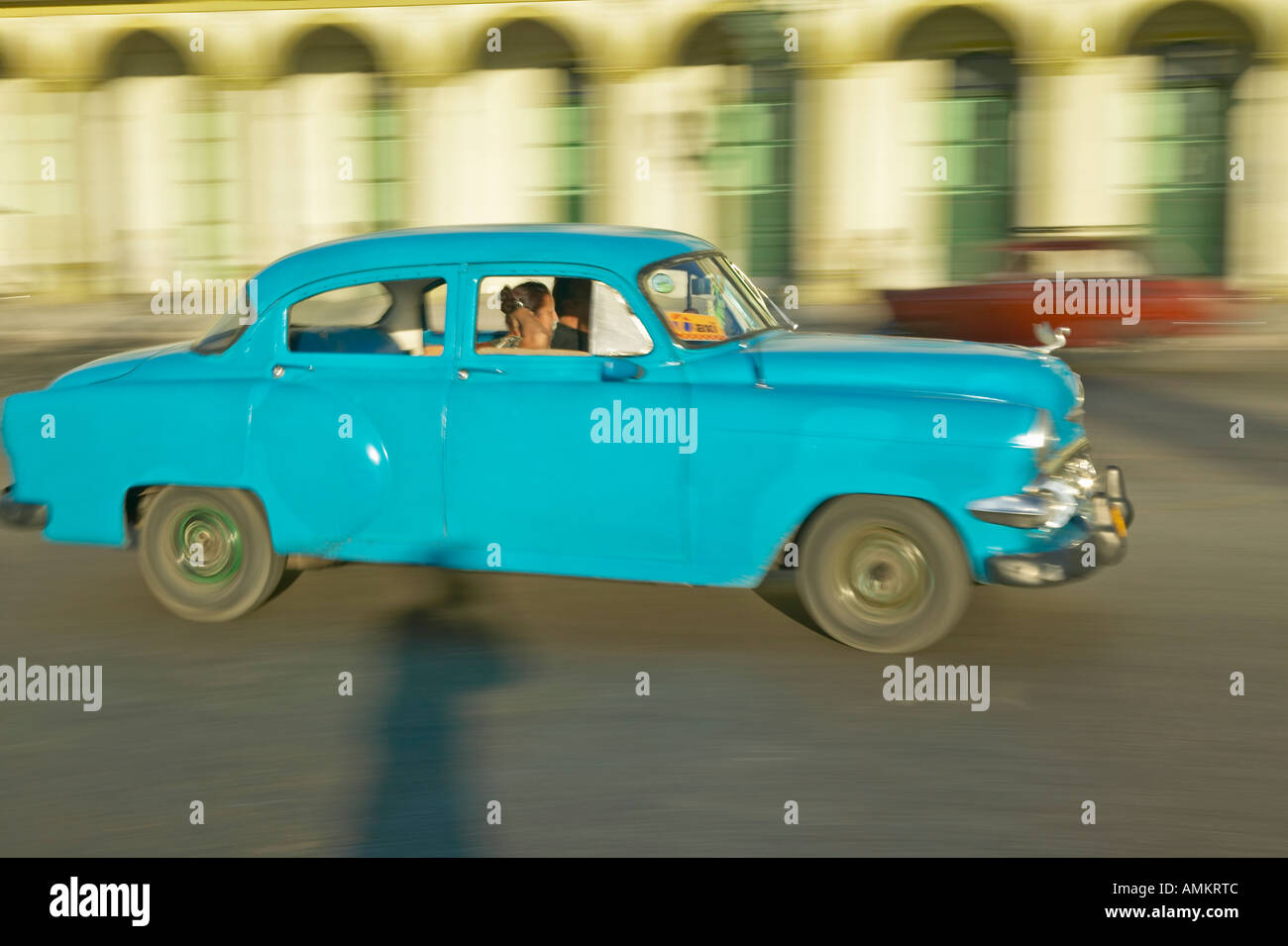 A turquoise car driving the streets of Old Havana Cuba Stock Photo