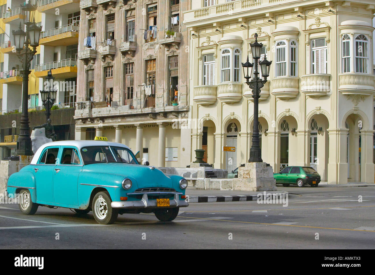 Turquoise taxi driving the streets of Old Havana Cuba Stock Photo