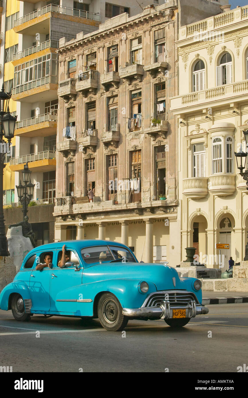 Turquoise car driving the streets of Old Havana Cuba Stock Photo