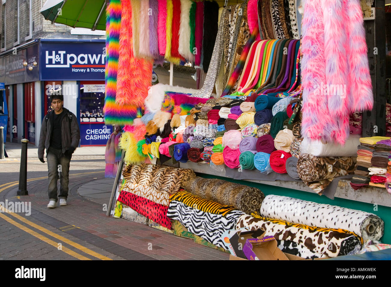 A market stall selling fabrics in Leicester market Leicestershire UK