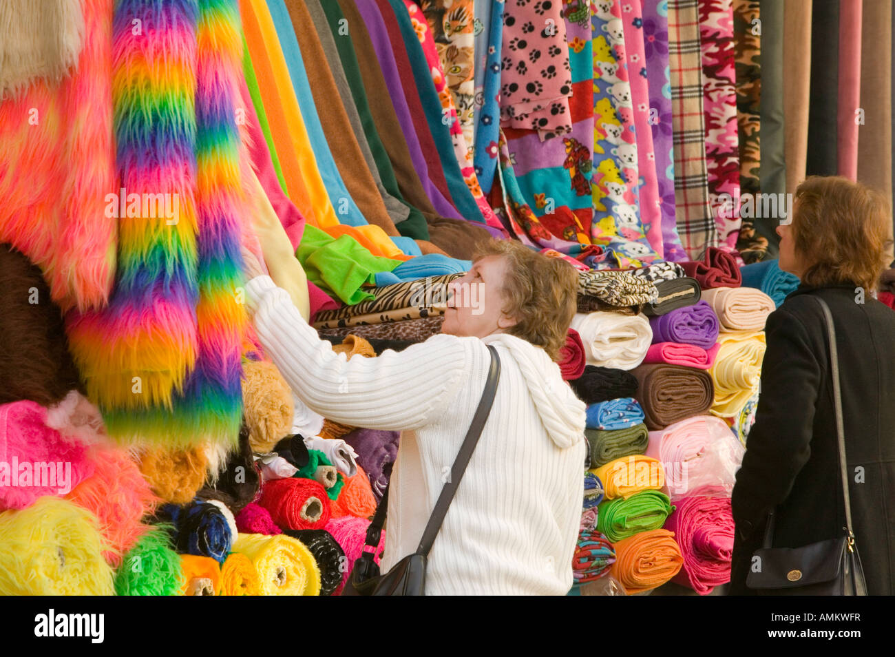 A market stall selling fabrics in Leicester market Leicestershire UK