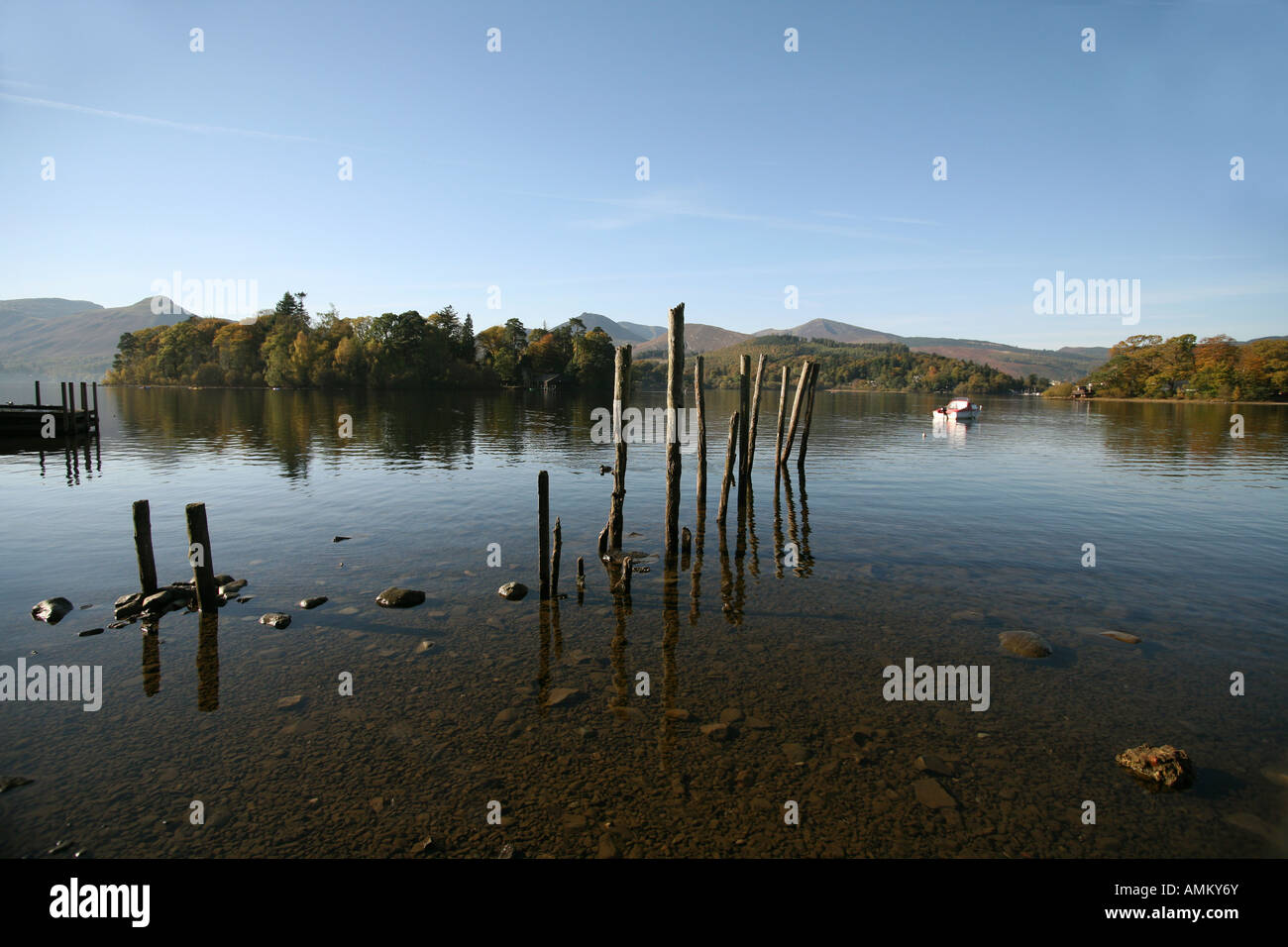 ,LAKE DISTRICT,BLUE SKY ,REFLECTIONS MOUNTAINS HILLS TREES STUMPS Stock Photo