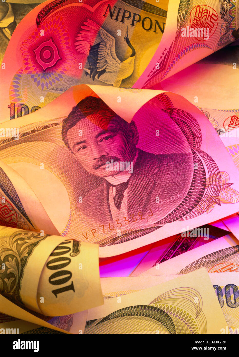 Close-up of Japanese banknotes in colored light Stock Photo