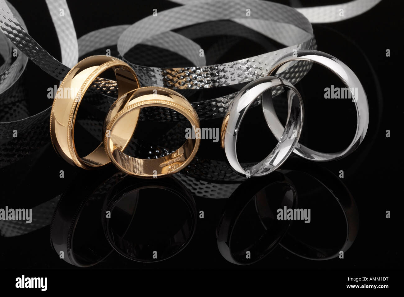 Wedding rings two yellow gold, two white gold Stock Photo