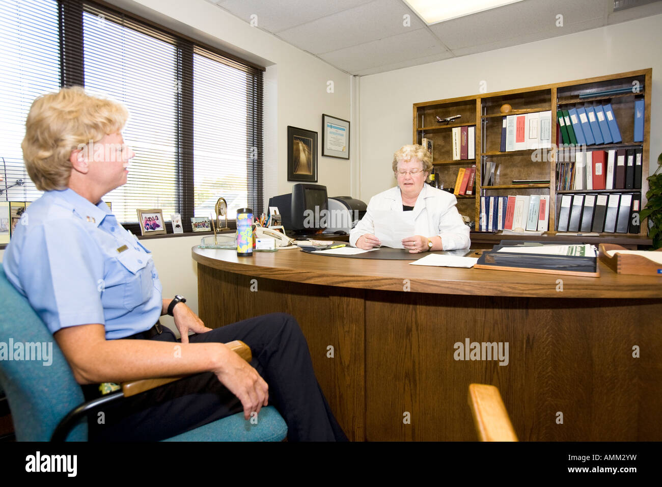 Female Captain talking to female prison Warden. Omaha Correctional
