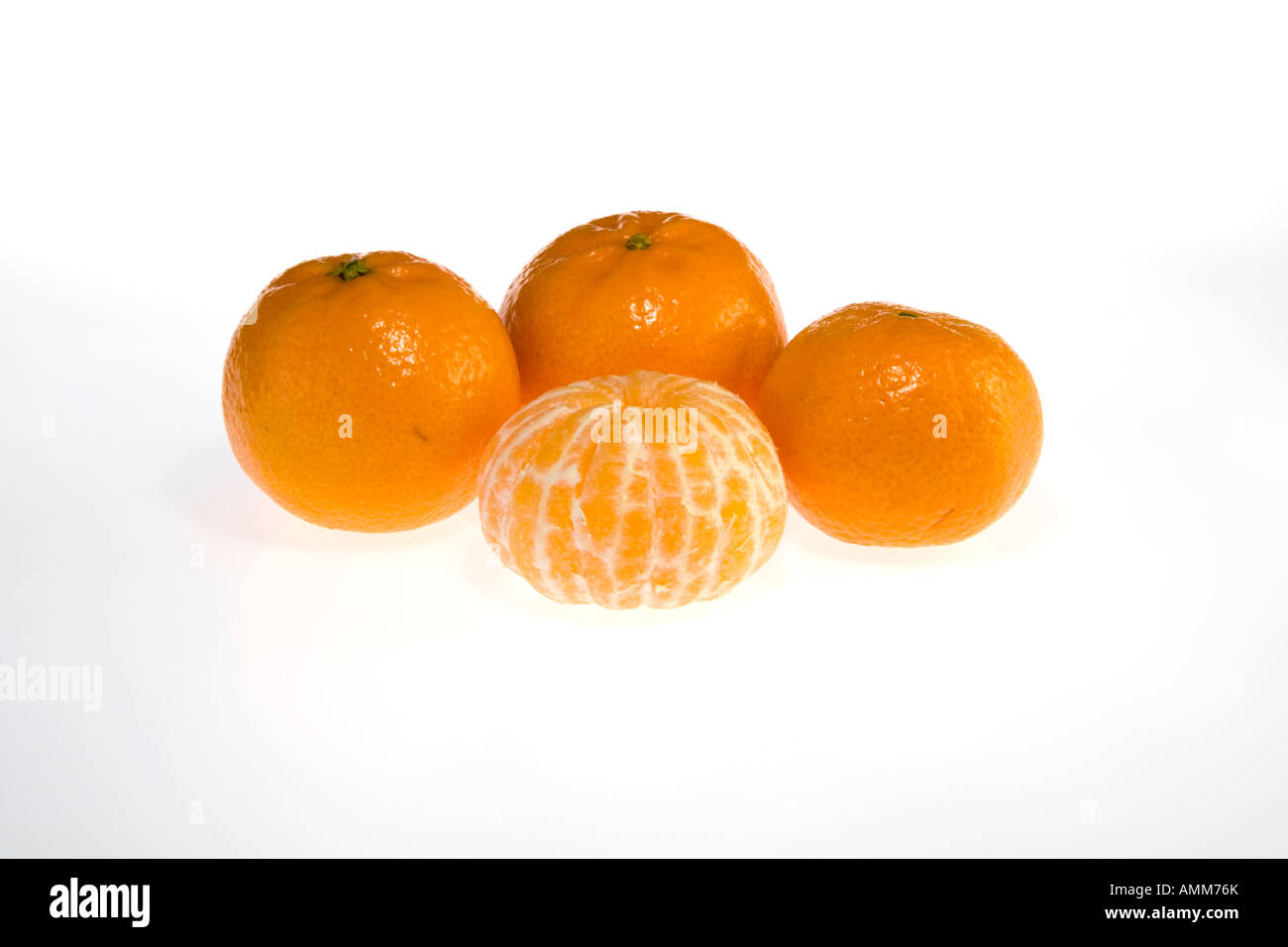 Four Clementines with one peeled Stock Photo Alamy